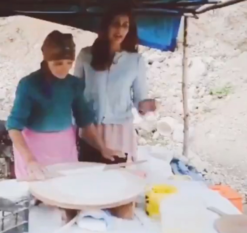 Upasana cooking with locals for Ram Charan