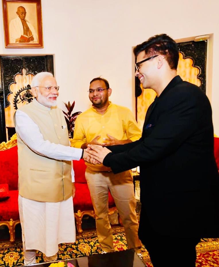 Baahubali presenter shakes Narendra Modi hand
