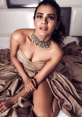 What is Hebah Patel trying to show on Bed ?