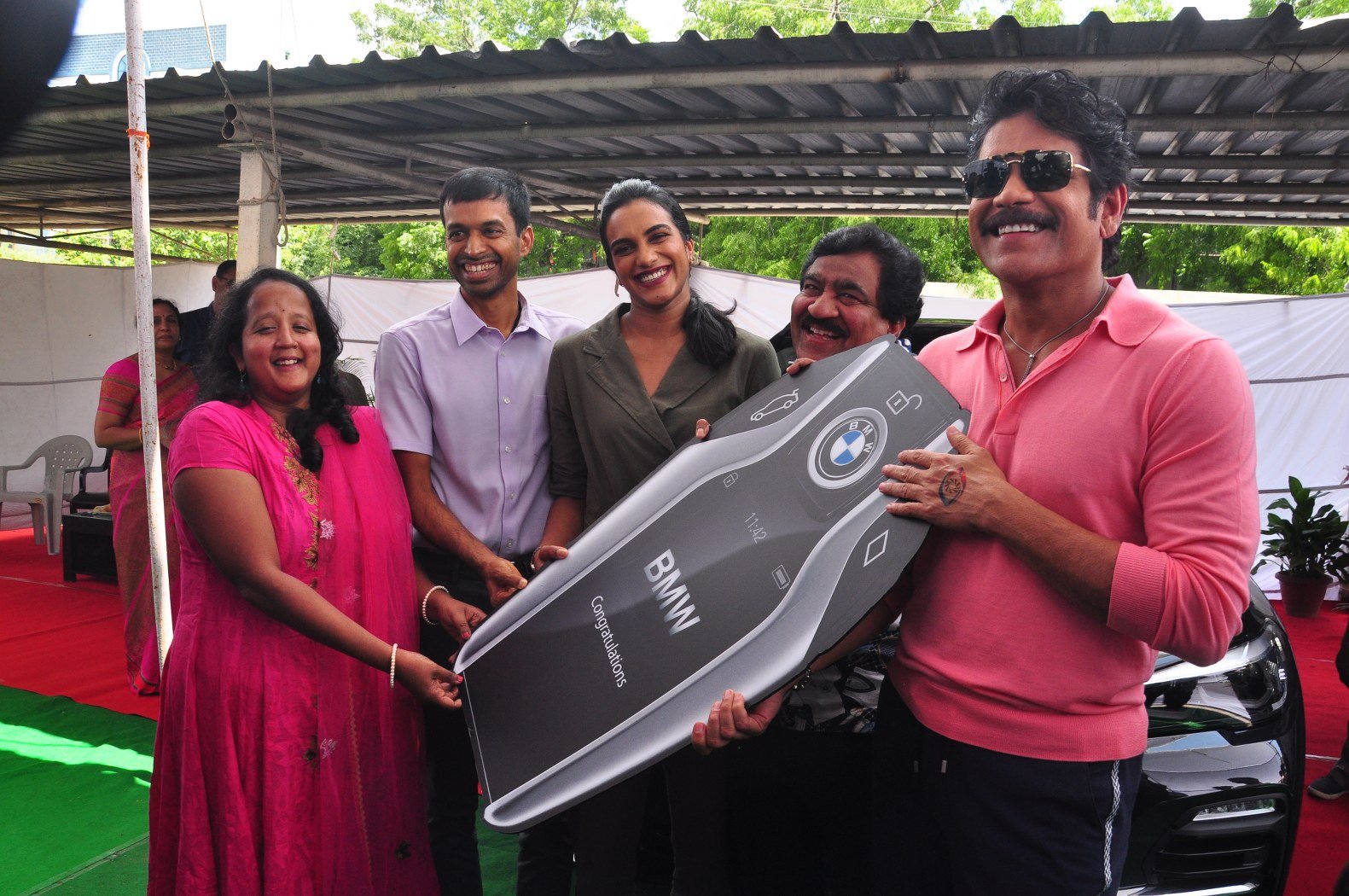 Nagrajuna gifts key of BMW car to PV Sindhu