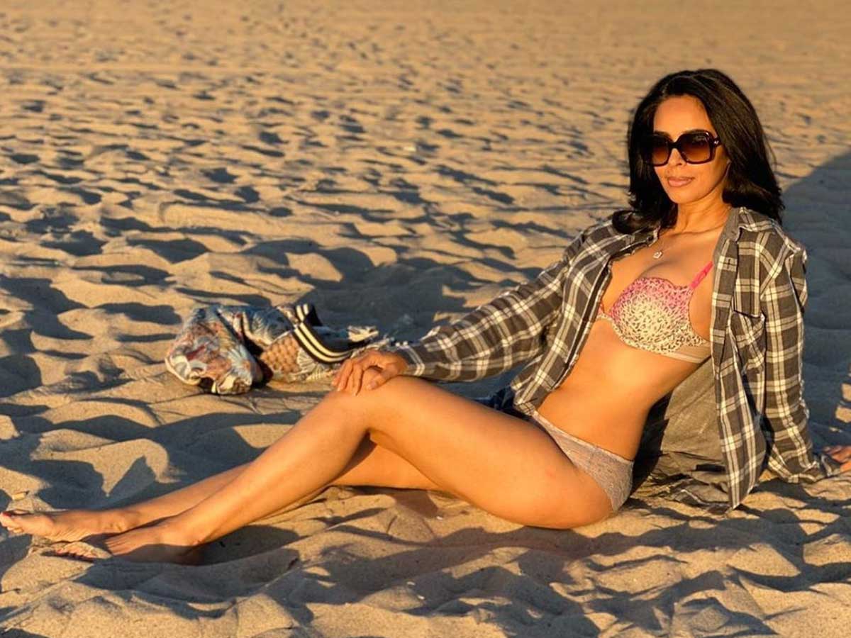 Bikini Clad Mallika Sherawat seduction on sand