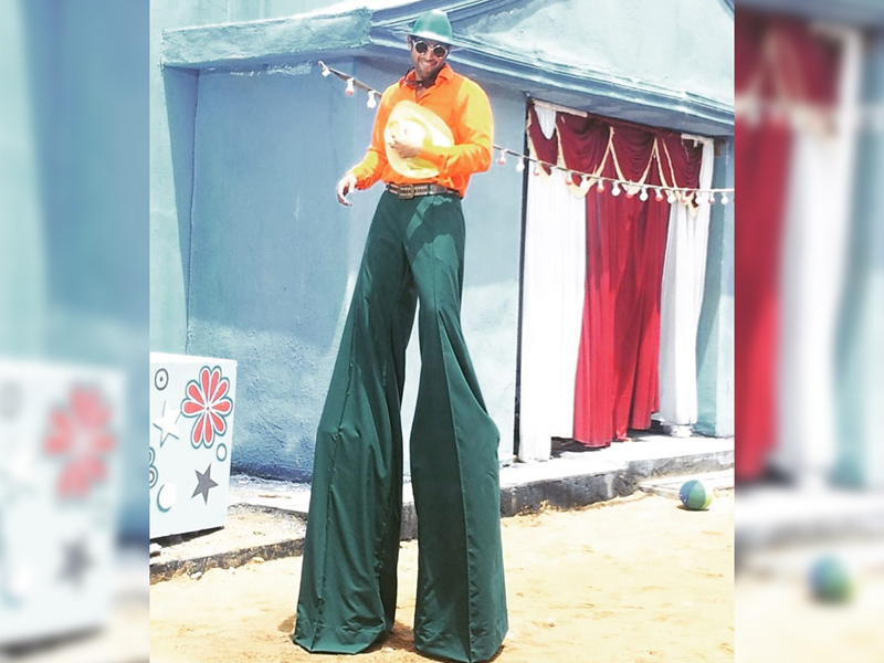 Rana Daggubati standing on circus stilts