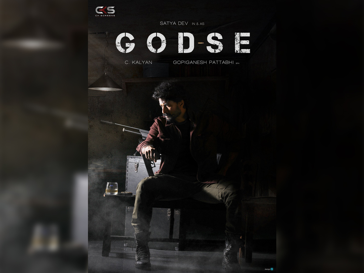 Godse Title Poster: Satya Dev sits in a den and holds a gun