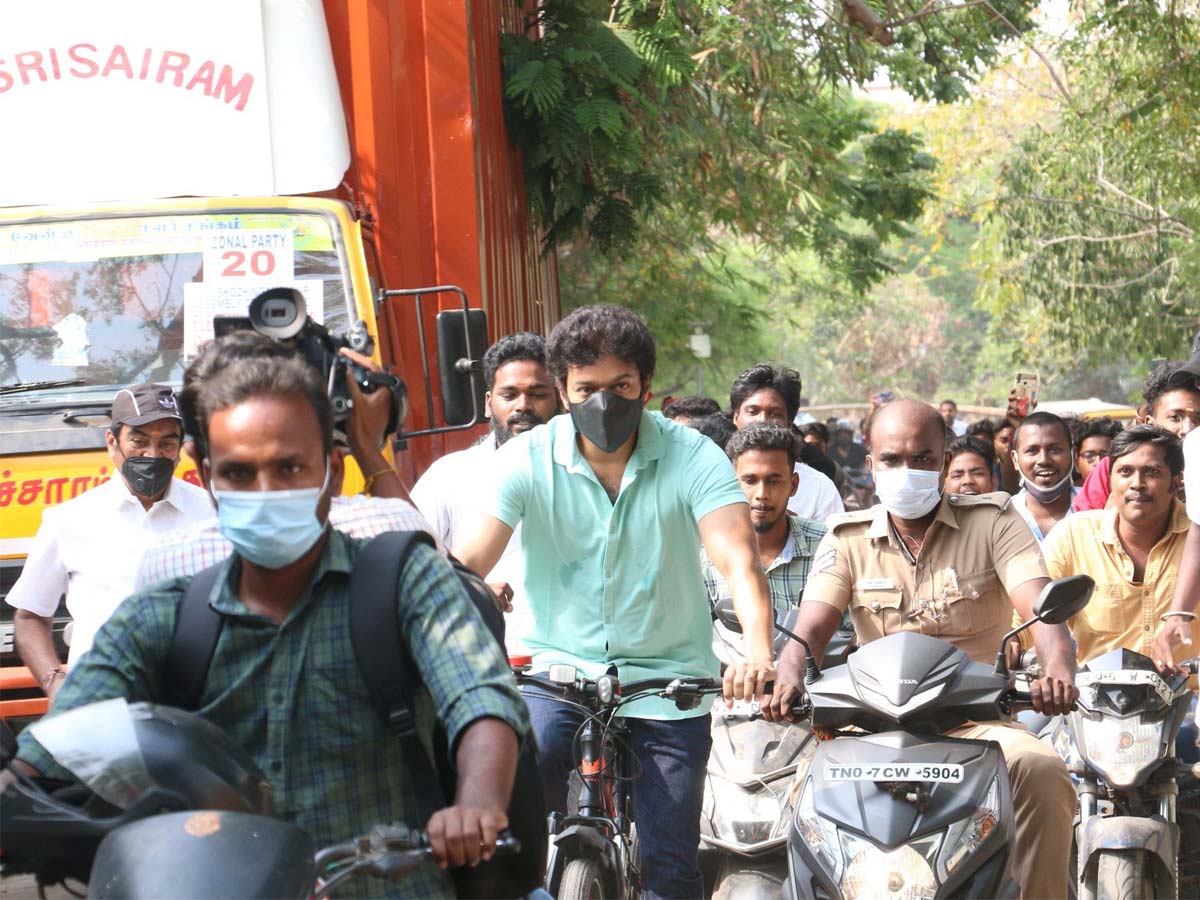 Vijay arrives on a bicycle to cast his vote