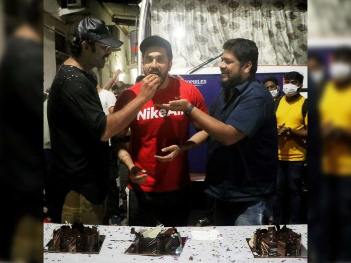 Prabhas feeding cake to Sunny Singh on Adipurush set