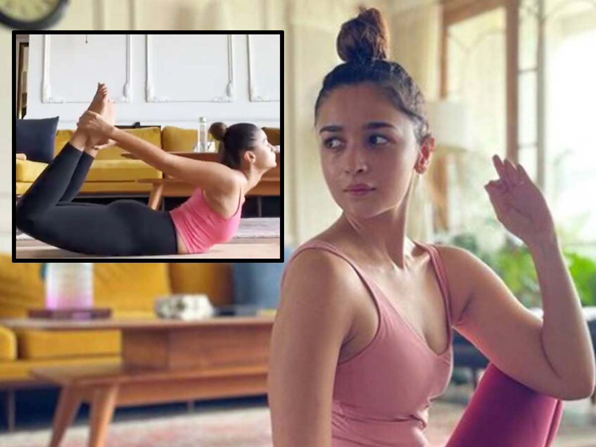 Wall-supported headstand by Alia Bhatt, practising yogasana