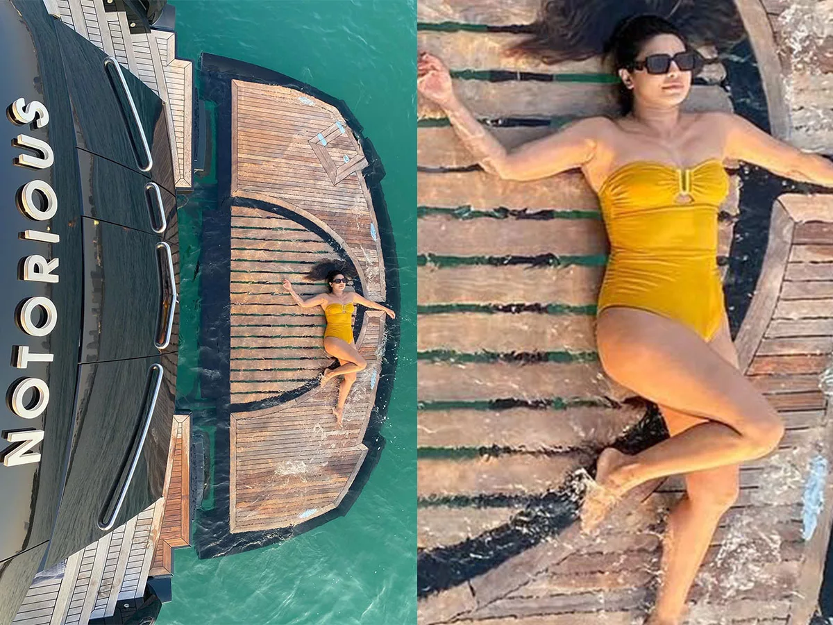 Priyanka Chopra in yellow bikini lying on the floor of the boat