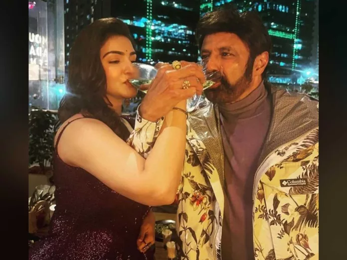 Balakrishna and Honey Rose drink champagne together in their style