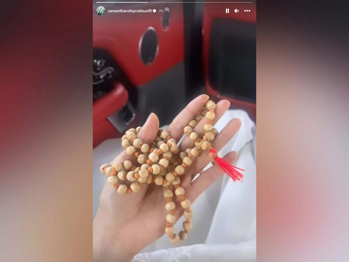 Spiritual Samantha doing japams holding a chain of beads