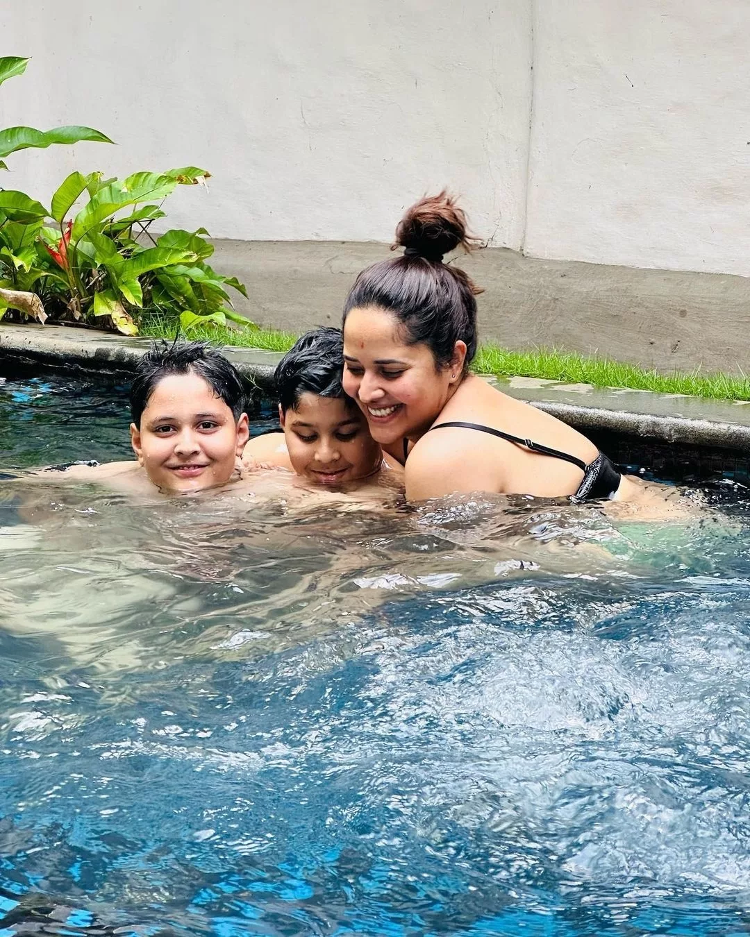 Anasuya Bharadwaj enjoys swimming with family